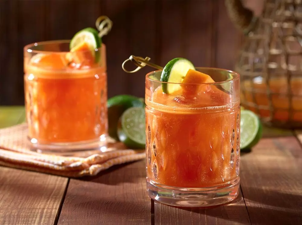 Papaya and pineapple refreshing cocktail